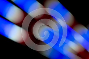 Defocused of photo bokeh blurred circle light from colorful neon lighting bulb in the night for abstract background