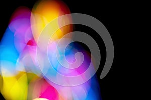 Defocused of photo bokeh blurred circle light from colorful neon lighting bulb in the night for abstract background