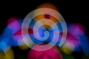 Defocused of photo bokeh blurred circle light from colorful neon lighting bulb in the night for abstract background