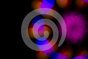 Defocused of photo bokeh blurred circle light from colorful neon lighting bulb in the night for abstract background