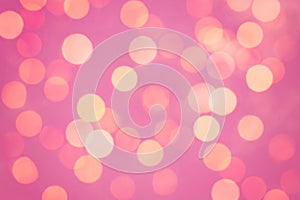 Defocused pink abstract christmas background. Bokeh on glitter sparkle background or confetti. Shallow DOF