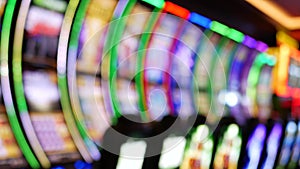 Defocused slot machines glow in casino on fabulous Las Vegas Strip, USA. Blurred gambling jackpot slots in hotel near Fremont