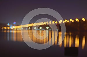 Defocused urban abstract texture bokeh city lights in the background with blurring lights for your design