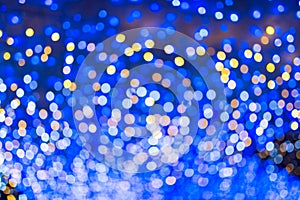 Defocused urban abstract texture, bokeh lights of city lights in