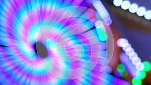 defocused video of colorful twisting lighting vertical composition