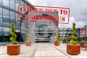 Defocused view of exterior of cinema, empty and closed due to coronavirus