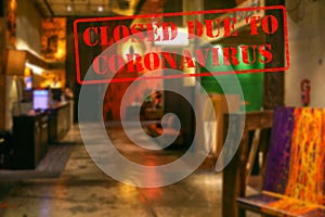 Defocused view of interior of an upmarket hotel reception, empty and closed due to coronavirus