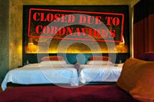 Defocused view of interior of an upmarket hotel room, empty and closed due to coronavirus