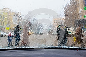 Defocused view of pedestrians from windscreen