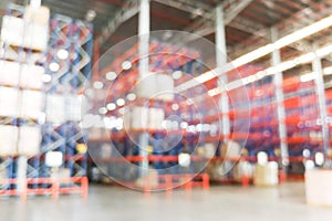 Defocused warehouse racks with cartons boxes as background