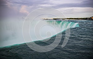 Defocused water background - whirlpool waves, blue tint. Abstract background with liquid fluid texture. Niagara river