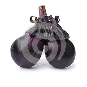 Deformed fresh purple twin eggplant isolated on white background close up photo