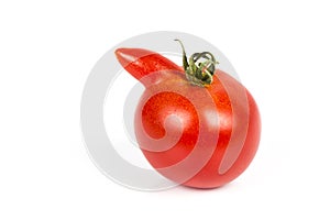 Deformed red tomato on a white background