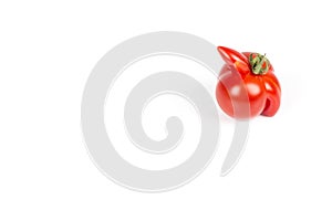 Deformed red tomato on a white background