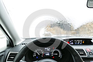 Defrosting ice from car windshield