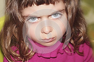 Defy outface little girl portrait looking gesture photo