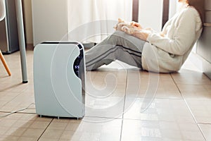 Dehumidifier with touch panel, humidity indicator, uv lamp, air ionizer, water container works at home. Air dryer