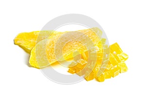 Dehydrated mango slices and cubes isolated on white. Candied diced mango fruits closeup