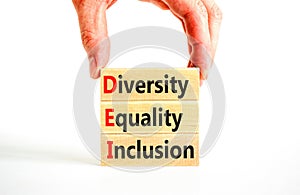 DEI diversity equality inclusion symbol. Concept words DEI diversity equality inclusion on blocks. Beautiful white background.