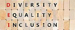 DEI diversity equality inclusion symbol. Concept words DEI diversity equality inclusion on blocks on beautiful wooden background.