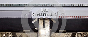 DEI, diversity equity inclusion certificated symbol. Concept words `DEI certificated` typed on old retro typewriter. Business, D