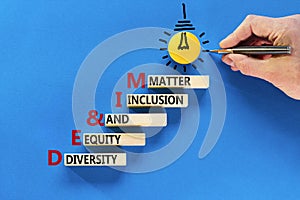 DEI Diversity equity inclusion matter symbol. Concept words DEI diversity equity and inclusion matter on wood block. Beautiful
