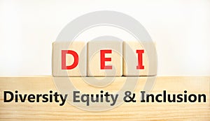 DEI diversity equity and inclusion symbol. Concept words DEI diversity equity and inclusion on blocks. Beautiful white background