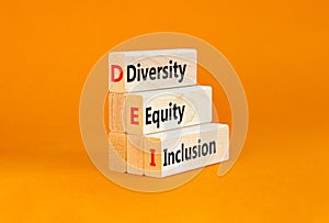 DEI diversity equity and inclusion symbol. Concept words DEI diversity equity inclusion on blocks. Beautiful white background.