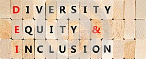 DEI diversity equity and inclusion symbol. Concept words DEI diversity equity and inclusion on blocks on beautiful wooden