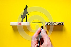 DEI diversity equity inclusion workplace symbol. Blocks with words DEI workplace on beautiful yellow background. Business DEI