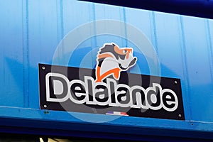 Delalande Peche logo text and sign brand on fisherman store facade