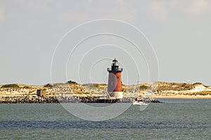 Delaware Breakwater East End Lighthouse  with sailboat