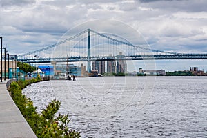 The Delaware River and Ben Franklin Bridge, seen from Penn`s Landing in Philadelphia, Pennsylvania