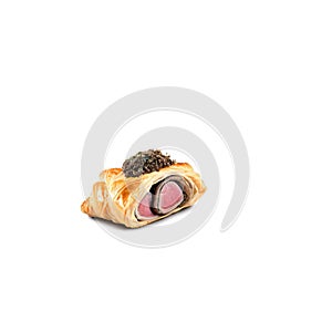 A delectable beef wellington, wrapped in puff pastry and topped with a mushroom duxelles,