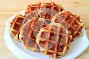 Delectable Belgian Waffles on White Plate Served on Wooden Table