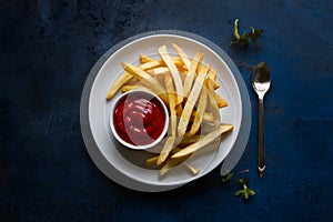 Delectable french fry served with tomato sauce