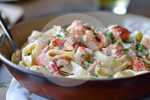 Delectable lobster meat combined with pasta for a mouthwatering twist on the classic lobster roll