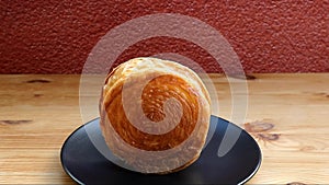 Delectable New York Roll or Supreme Croissant on Wooden Table
