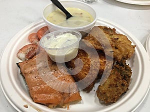 A Delectable Plate of Freshly Fried Fish with Tartar Sauce Dip and Cup of Chowder