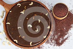 Delectable Ragi Halwa served in a round wooden tray