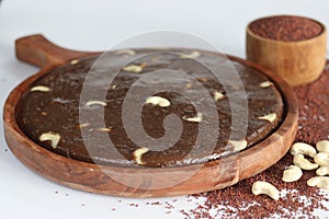 Delectable Ragi Halwa served in a round wooden tray