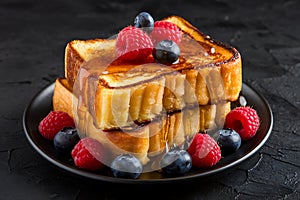 Delicious Golden French Toast with Berries and Syrup photo