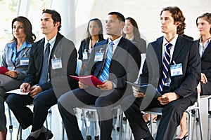 Delegates Listening To Speaker At Conference