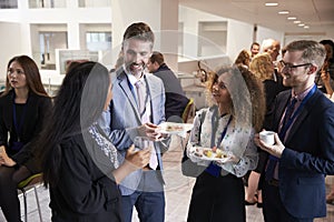 Delegates Networking During Conference Lunch Break