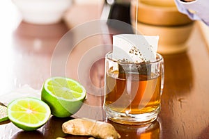 Deleighful cup of tea with ginger, lemon, home antimicrobial therapy