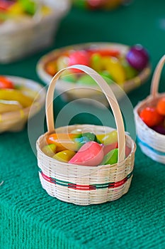 Deletable Imitation Fruits, Kanom Look Choup, in basket. Thai dessert