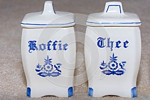 Delft Blue Coffee and Tea Koffie and Thee containers. Famous porcelain souvenirs from Holland/Netherlands.  on textured
