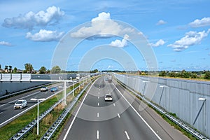 Modern deepened motorway A4 through a nature reserve close to Rotterdam, traffic direction The Hague, Netherlands