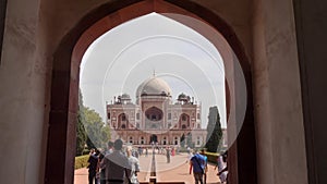 DELHI, INDIA - MARCH 12, 2019: humayun`s tomb framed by entrance arch in delhi