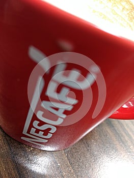 Delhi, India - March 20th 2020:A closeup shot of Coffee Cup from Nescafe on table